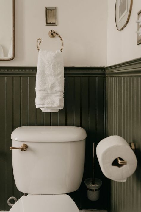 Bathroom Green Beadboard, Green Chair Rail Bathroom, Dark Olive Green Wainscoting, Olive And Cream Bathroom, Olive Green Beadboard Bathroom, Half Bathroom Beadboard, Olive And Black Bathroom, Bathroom Painted Beadboard, Dark Green And Brass Bathroom