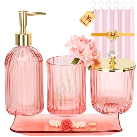 PRICES MAY VARY. Galss MULTIFUNCTION PINK GLASS BATHROOM ACCESSORIES SET -- 4 pieces pink and gold bathroom set includes a Lotion Soap Dispenser, a Vanity Tray, a Qtip Holder, and a Toothbrush Holder, Perfect for storing your toiletries or your cosmetics, the pink tray can also hold your jewelry and keeping your bathroom counter fully organized and neatly DECORATIONS FOR HOME APARTMENT / BATHROOM -- The pink glass bathroom set is ideal decoration fits various styles: rustic decor, bathroom decor, industrial style, western decor, modern style, contemporary decor, and country decor. Ideal bathroom accessories set for home decor, bathroom decor, and farmhouse decor. Great for the kitchen and bath, for countertop organize, vanity top, makeup table, and craft GREAT GIFTS IDEA -- A perfect gift Dorm Apartment Decor, Pink Bathroom Accessories, Gold Bathroom Set, Glass Bathroom Accessories, Pink Tray, Pink Bathroom Decor, Bathroom Accessories Set, Bathroom Decor Sets, Bathroom Tray