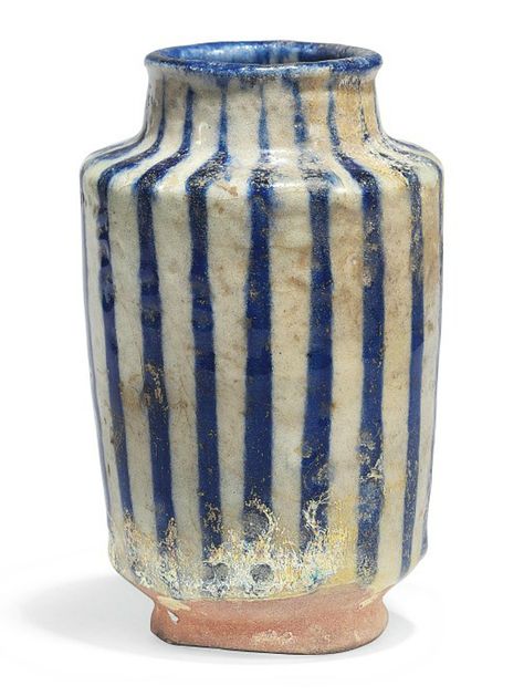 AN INTACT KASHAN POTTERY ALBARELLO  CENTRAL IRAN, 12TH CENTURY. Of typical form with slightly flaring walls on short ring foot, with short neck and rounded lip, the decoration with cobalt-blue lines on white ground, with old inventory number to foot Iranian Ceramics, Short Ring, Striped Vase, Ancient Pottery, Short Neck, Blue Lines, Antique Pottery, Art Ancien, Antique Vase