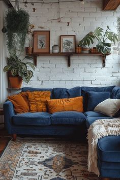 Navy Sofa Living Room Curtains, Blue Couch Living Room Ideas Boho, Vibrant House Decor, Blue Boho Living Room Inspiration, Boho Blue Couch, Peacock Blue Couch Living Room, Navy Couch Styling, Navy Couch Decor, Boho Couch Ideas