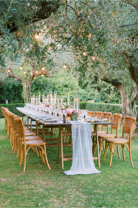 From the editorial "This Couple Got Married at Sting's Villa in Tuscany and It Was Nothing Short of Spectacular." The reception dinner took place in the Tuscan hills under sparkling olive trees with romantic floral arrangements that were absolutely dreamy. Just wait until you see the full gallery!  ​Photography: @eliaskordelakos  #tuscanywedding #destinationwedding #alfrescowedding #weddingreception #gardenwedding Fresco, Candles And Flowers, Romantic Italian, Al Fresco Dinner, Getting Married In Italy, Martha Weddings, Bistro Lights, Villa Wedding, Outdoor Dinner