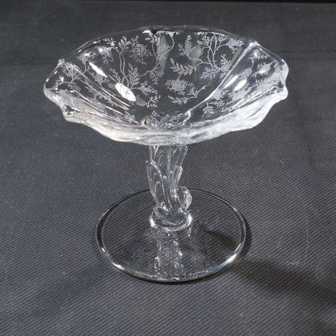 FOSTORIA Rose Chintz Compote Candy Dish Pedestal Base Etched Elegant Glass Flared  Vintage Compote Bowl or Candy Dish made by Fostoria Glass Company USA. Rose Chintz pattern featuring etched design. Clear elegant Glass. Pedestal base and flared rim Measures 4.5" tall by 5.5 inches wide at top. Clean with no chips or cracks. Was wedding gift from 1950s and very seldom used. SHIPPING AVAILABLE TO 48 United States. If shipping to Alaska or Hawaii, please contact us for additional shipping charges. ** See photos for more details. Please note that we take the time to clean our items as much as possible before posting. We also provide hi-resolution & high-quality photos so you can better see what you are actually purchasing. (3085) Thanks for visiting O'Sullivan's Attic. Be sure to see the other