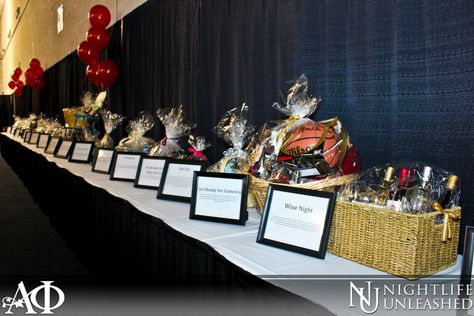 Nice basket table. Concise. Could use a pop of interest but like how easy to see descriptions and not cluttered.  Gamma Phi Auction Table. Love the frames to display the item descriptions. Fundraising Table Decorating Ideas, Auction Party Ideas, Auction Table Display Ideas, Fundraiser Table Ideas, Silent Auction Table Display, Silent Auction Set Up Display, Raffle Display Ideas, Silent Auction Set Up, Raffle Table Ideas