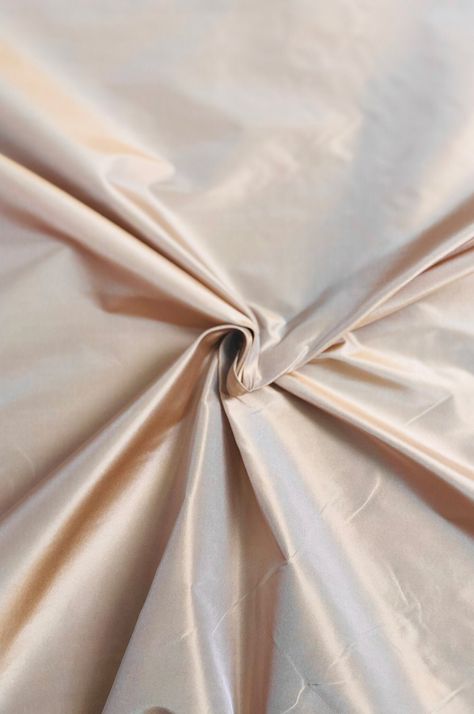 Silk taffeta is a shiny, durable, medium-weight fabric with an elegant drape. It has a crisp and smooth finish, generally used for high-end evening gowns, wedding dresses, fashion linings, and interior use, such as draperies. This Toasted Almond Taffeta Silk Fabric holds its shape very well and is ideal for creating voluminous garments that take advantage of this silk's sheen and crispness. Taffeta is a unique and distinctive fabric that is very easy to sew. This fabric is available in a wide range of colors. The fabric is sold by the Yard, and measures 54 inches in width. Wedding Dresses Fashion, Dupioni Silk, Elegant Drapes, Gowns Wedding, Easy To Sew, Silk Taffeta, Toasted Almonds, Silk Wool, Wool Fabric