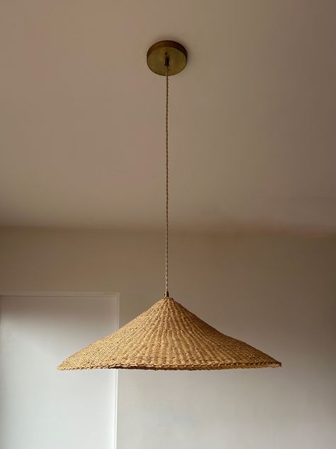 Our Sunhat pendant light is one of our most popular woven light fixtures. Handcrafted in a shallow cone shape from richly textured indigenous and sustainable elephant grass, this woven light shade is made by members of SWOPA, a women's organization for traditional arts in northern Ghana. Each natural grass lampshade is woven by hand and each is slightly uniquely different. Emitting a warm glow these woven pendant lights are ideal for any living space. SHADE DIMENSIONS* Size Height Diameter MEDIU Dining Pendant Light, Plug In Pendant Light, Interior Design Plan, Large Pendant Lighting, House On The Rock, Kitchen Pendants, Handmade Lighting, Ceramic Pendant, Pink Room