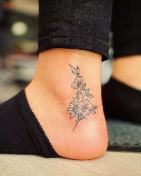 Friendship Ankle Tattoo, Birth Flower Anklet Tattoo, Upper Ankle Tattoos For Women, Small Sunflower Tattoo On Ankle, Outter Ankle Tattoos For Women, Vertical Ankle Tattoos For Women, Cover Ankle Tattoo, Country Ankle Tattoo, Mom Ankle Tattoo