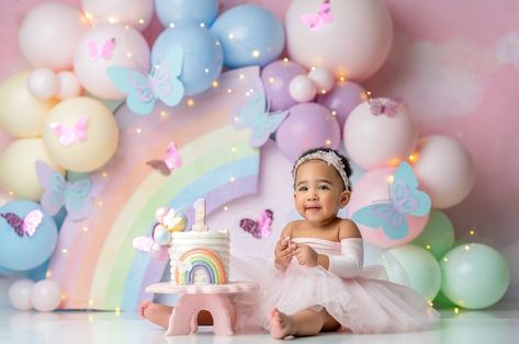 Smash Cake Colorful, Butterflies And Rainbows Birthday, Pastel Rainbow Photoshoot, Rainbow Birthday Photoshoot, Pastel Butterfly Birthday Party, Pastel Rainbow Cake Smash, Rainbow Balloon Backdrop, 1st Birthday Rainbow Theme, Butterfly Smash Cake