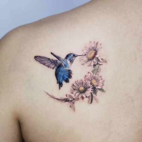 Hummingbird Tattoos: Meanings, Tattoo Designs & Ideas Hummingbird Tattoo Meaning, Hummingbird Flower Tattoos, Bird And Flower Tattoo, Small Hummingbird Tattoo, Lilac Tattoo, Flower Tattoo Meanings, Omerta Tattoo, Birth Flower Tattoos, Sunflower Tattoos