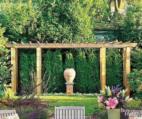 Create a focal point in your backyard with a decorative pergola. This pergola adds depth and dimension to the lushly landscaped yard and provides a framework for one of the owners' favorite sculptures. Decorative Pergola, Dream Backyard Garden, Pergola Curtains, Pergola Ideas, Backyard Garden Landscape, Vegetable Garden Planning, Building A Pergola, Modern Pergola, Pergola Attached To House