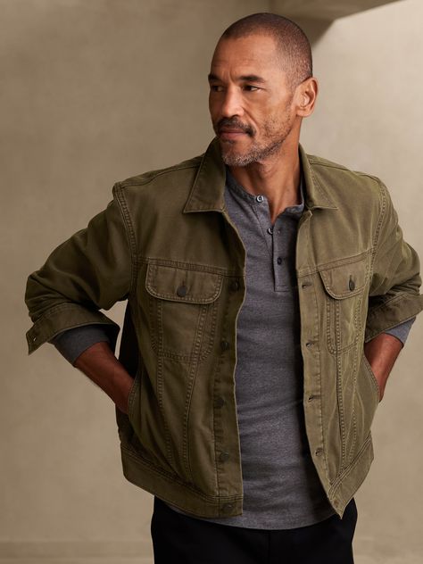 At once, undeniably rugged and refined, this timeless trucker jacket is crafted from a soft, sturdy cut of cotton canvas, ideal for layering throughout the seasons.  WARM: Unlined and perfect for layering.  RELAXED FIT: Cut for a loose fit with a dro Workwear Fashion Men, Trucker Jacket Men, Aztec Jacket, Mens Rugged, Canvas Jacket, Rugged Style, Layering Outfits, Stylish Mens Outfits, Men's Coats & Jackets