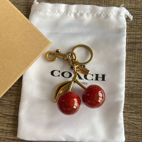 Coach Glitter Resin Red Cherry Bag Charm Keychain Keychain Cherry Coach Charm, Coach Purse Charms, Cherry Bag Charm, Coach Cherry Charm, Cute Car Keychains, Fall Trinkets, Coach Bag Charm, Coach Cherry Bag, Cherry Coded