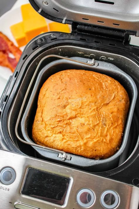 This easy-to-make bread machine cheese bread recipe is made with cheddar cheese and crisp bacon swirls in the dough before baking. Bread maker recipes take all the work out of making fresh baked bread, and this cheddar bacon bread version is no exception. Perfect for soup, sandwiches, and toasting! Bread Machine Recipes Fall, Bread Machine Recipes Bacon And Cheese, Bread Maker Breakfast Bread, Bread Maker Bread Recipes Simple, Cheese Bread For Bread Machine, Bread Maker Recipes Savory, Cheese Buns Bread Machine, Bread Maker Bagels, Cheese Bread In Bread Machine