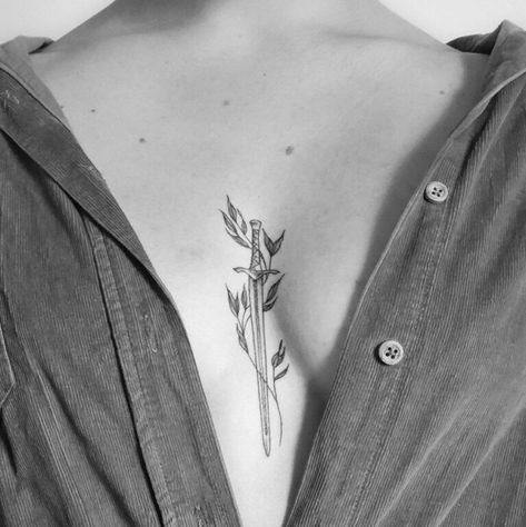 210+ Best Sword Tattoo Designs With Meanings (2022) - TattoosBoyGirl Swords Sternum Tattoo, 96 Tattoo, Witcher Tattoo, Look Attractive, Dagger Tattoo, Sternum Tattoo, Tattoo Designs And Meanings, Abstract Tattoo, Little Tattoos