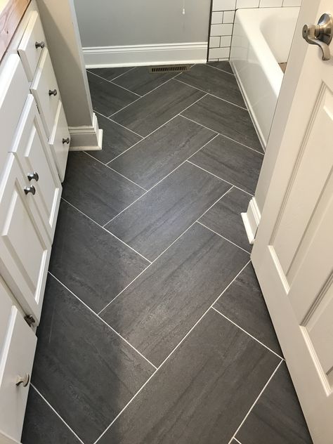 Farmhouse Bathroom Tile Floor Ideas, Grey Bathroom Flooring Ideas, Floor Ideas For Bathroom, Black Tile Entryway Floor, Bathroom Floor Tile Baseboard, Bathroom With Hardwood Floor Tile, Trending Bathroom Floor Tile 2023, Dark Shower Tile With Light Floor, Bathroom Tile Floor Patterns