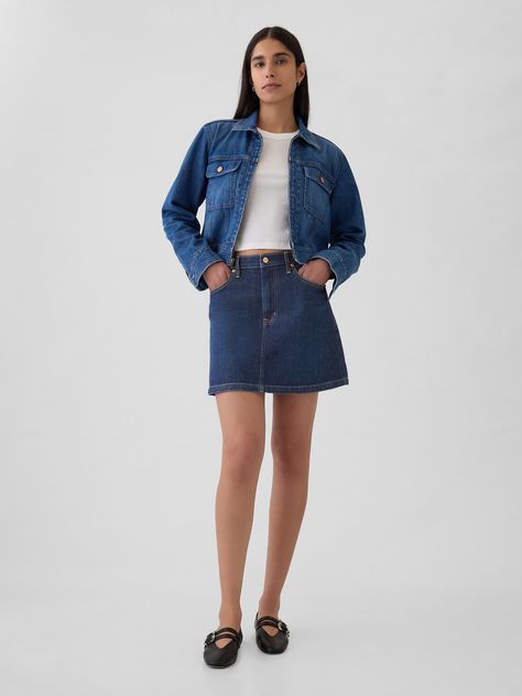 Soft, stretch denim mini skirt.  Button closure, zip fly.  Classic 5-pocket styling.  Dark indigo wash.  Responsibly Made: This denim skirt is part of our water-saving Washwell program.  Compared with conventional wash methods, Washwell uses at least 20% less water and has saved over a billion liters of water since 2016.  * Fit: Classic.  An easy silhouette that's slim at the waist & relaxed throughout.  Hits above the knee.  Models wearing Gap Women's Skirts, Autumn Clothes, Fw 2024, Womens Denim Skirts, 90s Denim, Fall Clothes, Dark Indigo, Gap Denim, Denim Mini