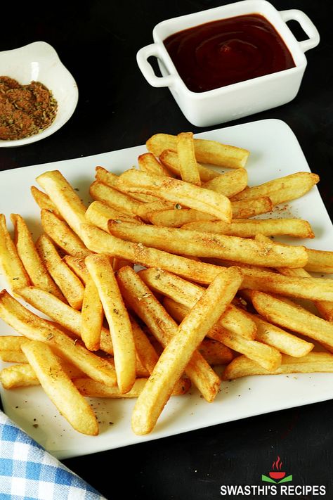 French fries are arguably the perfect snack or side dish when you are craving something crisp, salty, savory, and satisfying. In this post I share the easiest way to make perfectly crisp French fries each time you make. Tossed in a special shaker seasoning, these French fries make one of the best and super addictive snack. #frenchfries Indian Evening Snacks, Gluten Free French Fries, Evening Snacks Recipes, Indian Snacks Recipes, Evening Snacks Indian, Finger Chips, Easy Indian Snacks, French Fries At Home, Hebbars Kitchen