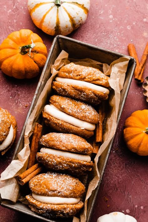 Pumpkin Whoopie Pies are pillowy soft and made with a whole can of pumpkin and plenty of cozy pumpkin spice. They're sandwiched around a silky brown butter cream cheese frosting and topped with a flurry of powdered sugar. Serve these pumpkin treats at a Halloween party or to switch things up at Thanksgiving! Stephanie Simmons, Brown Butter Cream Cheese Frosting, Brown Butter Cream Cheese, Pumpkin Whoopie Pies, Butter Cream Cheese Frosting, Pumpkin Syrup, Pie Flavors, Pumpkin Treat, Pumpkin Pie Filling