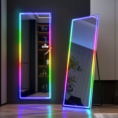 Illuminate your space with this full-length wall mirror, featuring an integrated LED strip that adds a touch of color to your bedroom or salon. Seven vibrant hues (white, light blue, pink, red, yellow, blue, and green) allow you to customize the brightness, while the memory function keeps your last setting for added convenience. The clean-lined rectangular design gives it a minimal silhouette that complements a variety of design styles. Plus, this mirror measures 63" tall, so it's sure to reflec Full Length Mirror With Led Lights, Full Length Mirror With Lights, Stand Up Mirror, Large Floor Mirror, Full Body Mirror, Mirror With Led Lights, Body Mirror, Rgb Led Lights, Bedroom Mirror