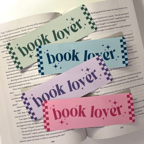 Book Lover laminated bookmark Handmade laminated bookmark. Printed on 110lb cardstock and then thermal laminated. Single sided. Bookmark measures roughly 2" X 6" Please allow for slight variations in color due to lighting and different screens. Please be aware that lamination can separate if you bend your bookmark. SHIPPING All bookmarks are shipped in envelopes with standard envelope shipping. Please contact me with any questions about shipping. BOOKMARKS ARE FINAL SALE! If your bookmark arrive Bookmark Packaging Ideas, Diy Bookmarks Easy, Valentines Day Bookmarks, Book Mark Design, Cute Bookmarks Handmade, Cute Bookmark Ideas, Bookmark Ideas Aesthetic, Bookmark Design Ideas, Bookmarks Design