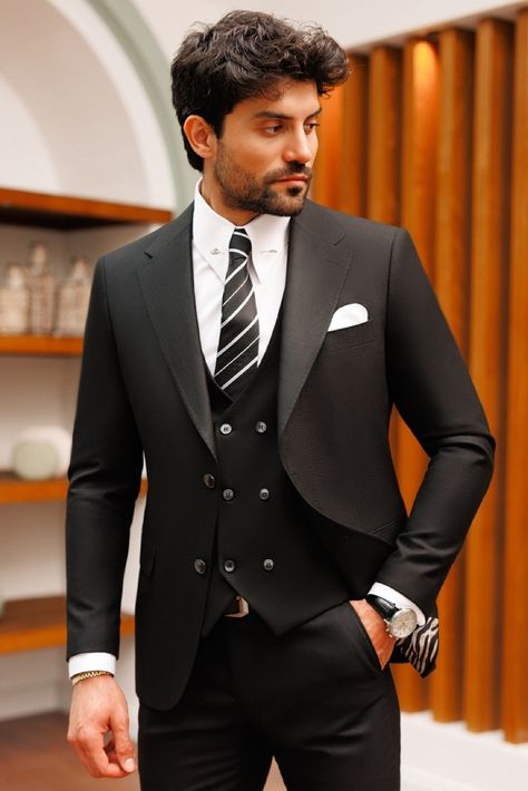 Elevate your style with our bold black slim-fit suit 3-piece. Indulge in an exquisite ensemble showcasing notch lapels, delivering a polished and refined appearance for today's discerning gentleman. #suit #suits #suitup #formalattire #menstyle #menfashion #gentleman #dapperlook #formalwear #fashioninspo #blacksuit Black 3 Piece Suit, Blazer Waistcoat, Grooms Men, Tweed Men, Peaky Blinders Suit, Dapper Suits, Timeless Outfits, Suits Men, Slim Fit Suits