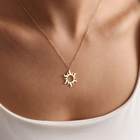 The Minimal Sun necklace stands out as a unique piece of handmade astrology and celestial symbolic jewelry. It is adorned with minimalistic design elements inspired by the sun. This elegant gold sun necklace will reflect your brightness on those wonderful days. MATERIAL 14kt Gold-Filled jewelry is crafted by bonding a plated layer of 14kt gold onto another metal. However, this layer is 1000 to 10,000 times thicker than gold plating. As a result, it creates a durable, long-lasting product that re Minimal Silver Jewelry, Minimal Gold Necklace, Gold Sun Necklace, Nail Polish Style, Minimal Gold, Celestial Sun, Pretty Jewelry Necklaces, Sun Necklace, Necklace Stand