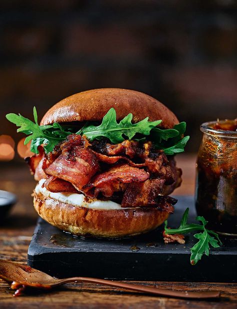 A new take on the classic bacon sandwich recipe, these smoky buns with homemade date ketchup are ideal for a weekend brunch treat Bacon Jam Burger Recipes, Burgers With Bacon Jam, Bacon Sandwich Recipes, Aesthetic Food Burger, Bacon Sandwiches, Bacon Rolls, Bacon Burger Aesthetic, Bacon Jam Burger, Brunch Burger