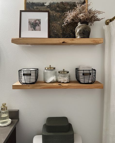 A little bathroom shelf refresh! Swapped out some storage containers, moved around some decor from other rooms, & voila-this space now feels fresh and new without spending a fortune! Comment SHOP below to receive a DM with the link to shop this post on my LTK ⬇ https://liketk.it/4OV2A . . . . #mixerofstyles #interiordesign #hometakestime #transitionaldesign #mydomaine #wearevivir #mycrumbshome #bathroomdesign #shelfie #bathroomdecor #bhghome #bhgstylemaker #interiorstyling #theeverygirlatho... Bathroom Shelves By Tub, Shelves About Toilet, Bathroom Shelf Over Toilet, Bathroom Shelving Above Toilet, 2 Shelves Above Toilet, Shelf Decor In Bathroom, Modern Organic Bathroom Shelves, Top Of The Toilet Decor, Rustic Bathroom Shelf Decor