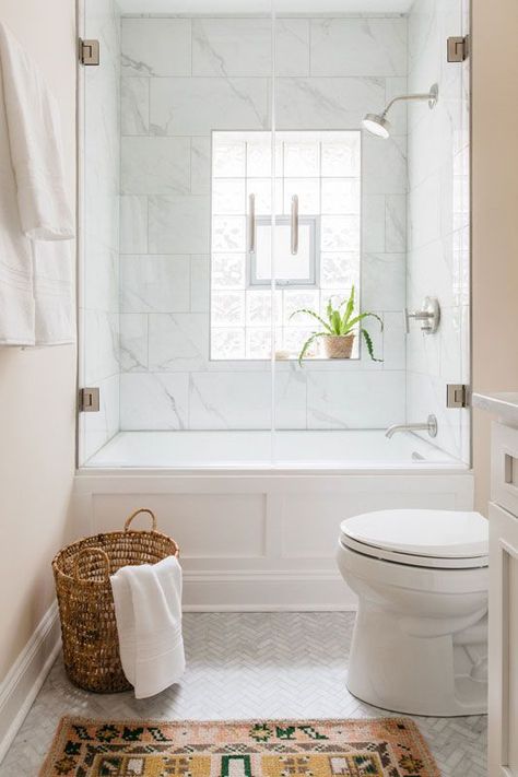 Glass shower door and glass block windows, marble herringbone floors and persian rug make for bright and modern master bath. Lakeview Chicago Master Bath — Sarah Montgomery Design Marble Herringbone Floor, Herringbone Floors, Marble Herringbone, Glass Block Windows, Glass Shower Door, Bad Inspiration, Hall Bathroom, Glass Block, Girls Bathroom