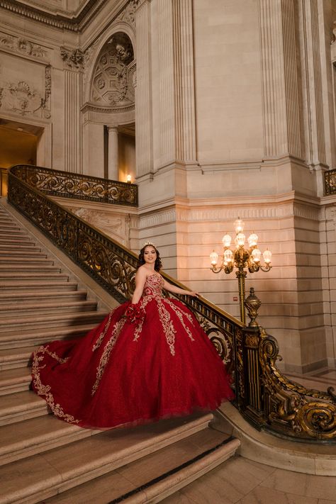 Beautiful Quinceanera by the staircase in stunning red dress for San Francisco City Hall pre-event session captured by wedding and portrait photographer based in Sacramento CA Red Quince Photoshoot Ideas, Quince Pictures Ideas, Quincenera Dresses Red, Pre Debut Shoot Ideas, 15 Photoshoot Ideas, Quince Poses Photo Shoots, Quince Photoshoot, Staircase Photoshoot Quince, Quinceanera Entrance Photo