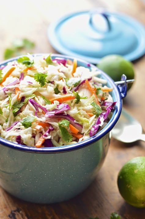 This Mexican cole slaw is lightened up with fresh lime juice and cilantro and takes about 5 minutes to make. Taco Coleslaw, Mexican Cole Slaw, Mexican Coleslaw Recipe, Mexican Coleslaw, Mexican Slaw, Coleslaw Recipes, Vegetarian Soups, Delicious Sweets, Spanish Dishes