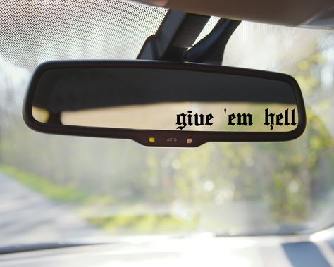 Show your bold personality with the Give Em Hell Car Mirror Decal! Attach this decal to your car mirror to make a statement and turn heads. Its vibrant colors will add a bit of flair to your vehicle and make you stand out in any crowd. Let your true colors shine with this unique accessory! **Please measure your area to make sure this fits your space**All decal pictures are for DISPLAY PURPOSES ONLY. They are not scaled to size. Sizes provided are in the drop-down box with the available sizes for Ghost Car Accessories, White Jeep Decor, Goth Car Decals, Spooky Car Decals, Rear View Mirror Decals, Rearview Mirror Decal, Emo Car Decor, Spooky Car Decor, Gothic Car Decor