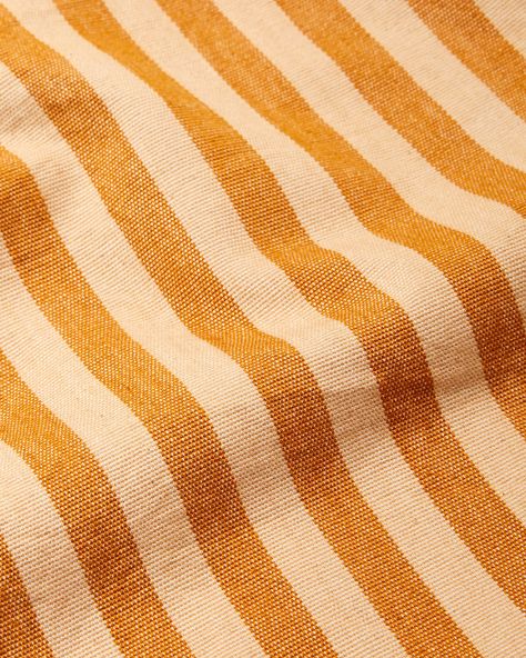 Sol Honey Fabric adds warmth and delight to any space. This fabric-by-the-yard is handwoven by artisan partners in San Antonio Palopó, Guatemala. Suitable for occasional-use furniture upholstery, window treatments, and other decorative elements. Handwoven in San Antonio Palopó, Guatemala. Striped Bedding, Striped Upholstery, Handwoven Fabric, Stripes Texture, Striped Towels, Gold Fabric, Fabric Sale, Decorative Elements, Furniture Upholstery