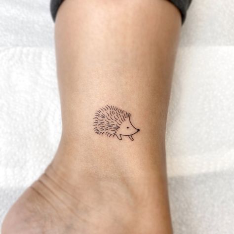 Tiny Fineline Hedgehog 🦔 ⠀ ❖⠀ ❖⠀ ☞ @saphirtattoos ⠀ ☞ @inkwelltattooclub ⠀ Hedgehog Outline Tattoo, Simple Hedgehog Tattoo, Hedgehog Tattoos, Shane Tattoo, Hedgehog Tattoo, Cute Matching Tattoos, Hedgehog Animal, Rose Shoulder Tattoo, Laser Removal