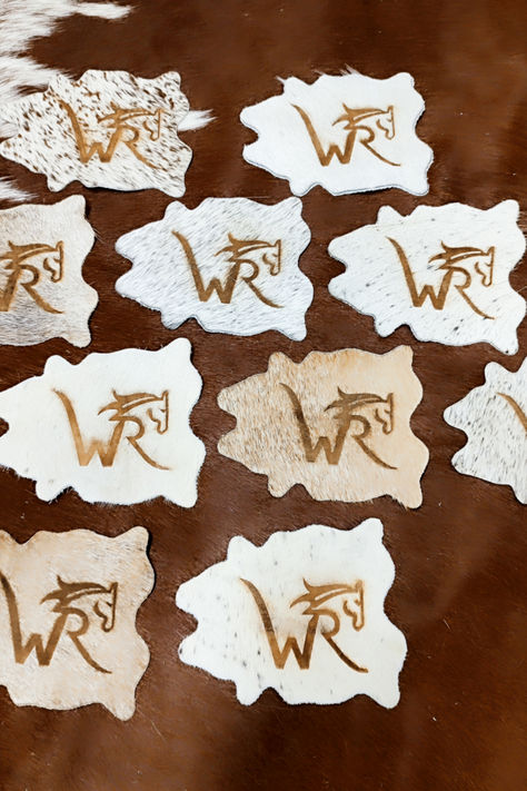 💍 Say "I do" to unique wedding favors that are as special as your love story! Introducing our branded cowhide wedding favors - the perfect blend of rustic charm and personalized elegance. 🐄✨  Imagine your guests' delight as they receive these beautifully crafted cowhide keepsakes, each adorned with your custom monogram or wedding logo. Whether you're celebrating in a barn, a garden, or a ballroom, these favors add a touch of countryside sophistication to your special day. Branded Cowhide, Cowhide Wedding, Western Wedding Favors, Cowhide Coasters, Custom Wedding Favours, Wedding Coasters, Wedding Branding, Wedding Logo, Leather Coasters