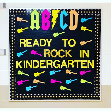 AB⚡️CD! Ready to ROCK in kindergarten!    #teacher #bulletinboard #kindergarten #kindergartenclassroom #backtoschool Rock And Roll Themed Bulletin Boards, Kindergarten Rocks Bulletin Board, Rock And Roll Door Theme, Rock Star Bulletin Board, Our School Rocks Theme, Rock Theme Classroom, Kindergarten Round Up Themes, Rock N Roll Bulletin Board, Rock N Roll Bulletin Board Ideas