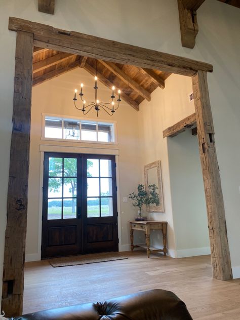 Pole Barn Front Doors, Modern Rustic Farmhouse Interior, Foyer Beams Entryway, Cathedral Ceiling Entryway, Barndo Minimum Interior, Barndo Entryway, Barndominium Foyer, Barn Beams In House, Vaulted Entryway Ideas