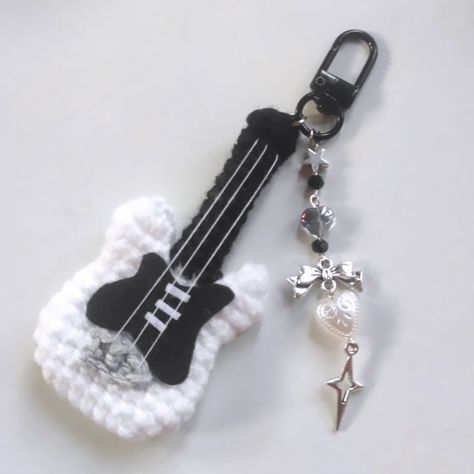 Crochet Guitar keychain 🎸💞 DM for order/enquiry The charms are made with good quality materials and stainless steel findings . . . Pattern: @chubbiesbyash . . #crochet #crochetkeychain #guitar #crochetguitar #guitarkeychain Crochet And Beads Keychain, Crochet Guitar Keychain, Easy Keychain Crochet, Crochet Projects Keychain, Key Chains Crochet, Crochet With Black Yarn, Crochet Key Chains Free Pattern, Crochet Ideas Keychain, Guitar Crochet