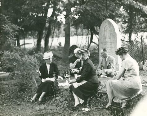 A small group picnics on ledger-style tombstones in Historic St. Luke's Ancient Cemetery. The photo is not dated but is believed to have been taken prior to St. Luke's 1957 Pilgrimage Service. American Cemetery, Cemetery Headstones, Raise The Dead, Old Cemeteries, Cemetery Art, Picnic Time, After Life, Memento Mori, Graveyard