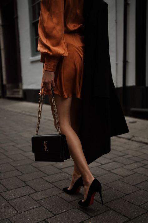 Black YSL Medium Sunset Bag with Orange Zimmermann silk wrap dress and Christian louboutin heels Ysl Sunset Bag Outfit, Ysl Bag Outfit, Ysl Sunset Bag, Ysl Outfit, Tassel Outfit, Ysl Kate, The Revenge, Silk Wrap Dress, Red Bottom Shoes