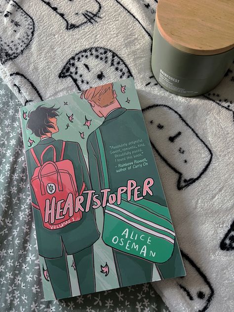 heartstopper volume 1 paperback book by alice oseman on green and white blanket with candle Alice Oseman, Cozy Reading Corners, Rainbow Rowell, Boy Meets, Netflix Streaming, Reading Corner, Cozy Reading, Coming Of Age, Book Authors