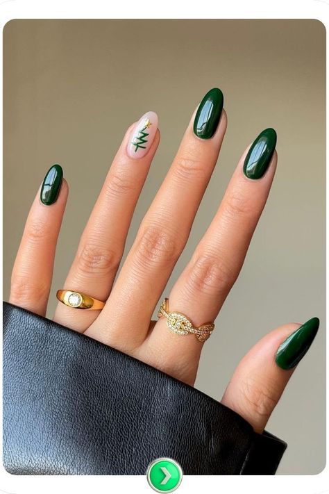 Elegant evergreen nail art design featuring deep green polish and a festive tree accent, perfect for capturing the holiday spirit with a classy winter look. Festive Nails Christmas, Winter Nail Art Ideas, Festive Christmas Nails, Tree Nail Art, Christmas Tree Nails, Dark Green Nails, Festive Nail Art, Tree Nails, Holiday Nail Designs