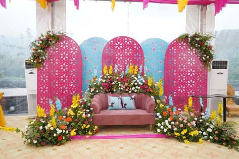 Photo From The vibrant and colourful monsoon Mehndi/Bhaat/Haldi function - By Jyotica Anand Mehndi Function Backdrop, Haldi Decor Backdrop, Bhaat Ceremony Decor, Haldi Backdrop Stage Decorations, Pink Haldi Decor, Mehandi Function Decoration, Haldi Stage Decor, Mehandi Backdrop, Haldi Stage Decoration