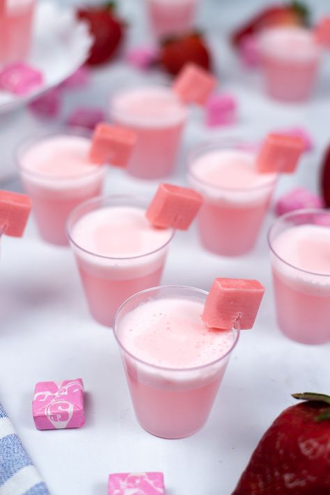 These Starburst Jello shots are a delicious and creamy strawberry Jello shot with the flavor of everyone’s favorite chewy fruit candies. Easy to make and perfect for parties, these are a fun and delicious twist on the classic Jello shot. Pastel Jello Shots, Pink Jello Dessert, Cute Party Appetizers, Jello Shot Charcuterie Board, Strong Jello Shots, Virgin Jello Shots, Pink Jello Shots, Strong Jello Shots Recipe, Fancy Jello Shots