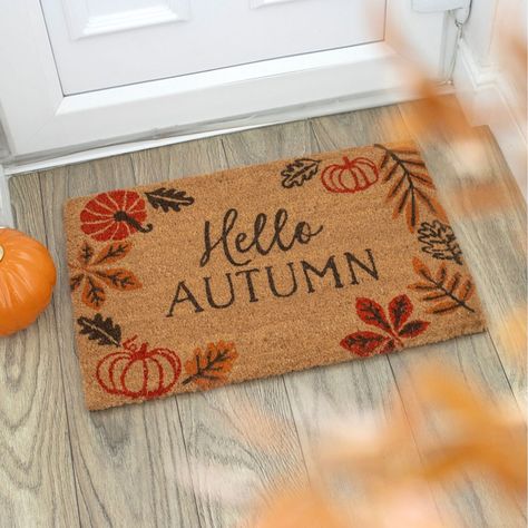 Welcome the beauty of fall with our delightful Hello Autumn Doormat. This charming coir mat features a lovely autumn leaf and pumpkin design paired with the warm greeting, "Hello Autumn," making it perfect for the season. Crafted for durability, it helps keep dirt and mud at bay while adding a cozy touch to your entryway. Best used in sheltered or indoor spaces, this doormat brings seasonal warmth and cheer to your home while offering an inviting welcome to guests. Add a touch of autumn to your decor today! Autumn Door Mat, Pumpkin Oil, Weather Design, Kitchen Candles, Pumpkin Leaves, Coir Mat, Coir Doormat, Cozy Gift, Autumn Leaf