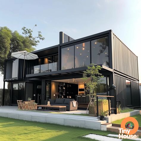 Check out this amazing shipping container house in a sleek and modern design! The combination of white, gray, black, and metallic colors creates a stunning visual appeal. Get inspired for your own container house project! Share with us what you're planning to build! #containerhouse #designinspiration #tinyhome Industrial Container Home, Container House With Garage, Loft Container Homes, House Container Ideas, Black Container Home, Large Container Homes, Container Van House Design, Modern Container House Design, Modern Container Homes