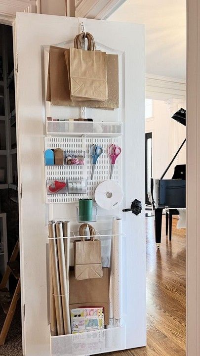 https://decomagz.com/20-genius-apartment-storage-ideas-for-small-spaces/ Apartment Storage Ideas, Target Bag, Storage Ideas For Small Spaces, Gift Wrap Organization, Gift Wrapping Station, Gift Wrap Storage, Wrapping Station, Over The Door Organizer, Apartment Storage