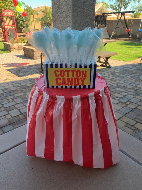 This set up was so easy to make as a cotton candy display. We wrapped a cardboard box in wrapping paper and cut spall holes at the top of the box to hold all of the yummy cotton candy. Cotton Candy Stand Display Diy, Cotton Candy Booth, Cotton Candy Display, Cotton Candy Stand, Birthdays Themes, Candy Booth, Circus Themed Birthday Party, Halloween Carnival Games, Cotton Candy Party