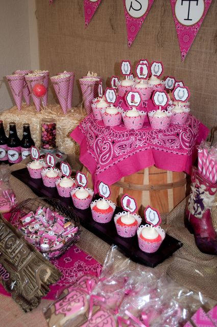 Incredible dessert table at a pink cowgirl party!  See more party ideas at CatchMyParty.com! Cowgirl Cake Table Ideas, Pink Cowgirl Dessert Table, Pink Rodeo Cake, Pink Cowgirl Cupcakes, Pink Cowgirl 1st Birthday Party, Pink Western Party Ideas, Cowgirl Table Decorations, Cowgirl Dessert Table Ideas, Pink Western Party Decorations