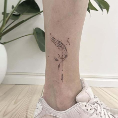 Fine Line Bird tattoo on foot #birdtattoodesign Pheonix Tattoo On Ankle, Phoenix Tattoo Ankle For Women, Small Tattoo For Ankle, Tattoo Design For Legs Women, Phoenix Leg Tattoo For Women, Phoenix Foot Tattoo, Phoenix Tattoo Ankle, Tattoo Foot Woman, Fenix Bird Tattoo