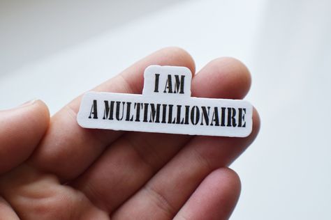 I Am A Multimillionaire Affirmation Stencil Style Die Cut Laminated Sticker  (About The Sticker) - Made In the USA by me. - Sticker style, die cut laminated - Size of sticker: 2.24"X0.88" - One time permanent application recommended for sticker to get best result from sticker. - Cool sticker for laptops, desks, water bottles, anything a sticker can stick to with the right amount of space. - Free shipping on every order & comes with Etsy's shipping tracking label. - Stickers are made with a high I Am Multimillionaire, Wealthy Affirmations, Affirmation Stickers, Pisces Season, Start A Small Business, Career Vision Board, Positive Mental Attitude, Financially Free, Money On My Mind